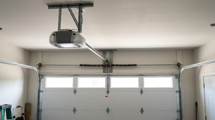 Garage door vibration and noise caused by opener and moving door components